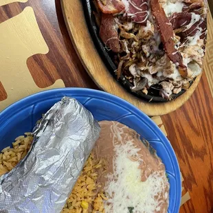 Can't remember the menu name but it was chicken, bacon, onions, bell peppers and cheese on a sizzling fajita platter, with beans and rice.