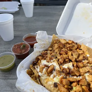 Chicken nachos loaded and a salsa bar