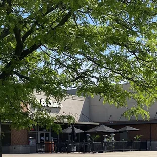 A nice outdoor seating area with umbrellas for shade and heaters when it&apos;s chilly!