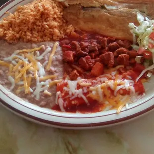El Charro&apos;s combo plate with rice, beans, a relleno, red chile con carne, and an enchilada. Overall, &quot;B&quot; in quality. Pepper lacked flavor