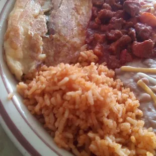 El Charro&apos;s combo plate: rice, beans, chile relleno, red chile con carne, and and enchilada. The chile pepper was not a flavorful one.