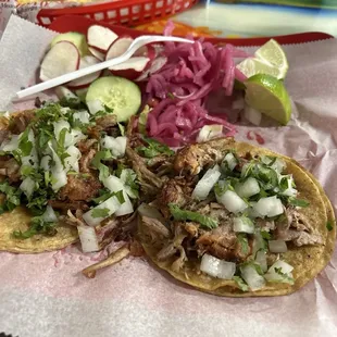 Just 2 tacos de Carnitas. Very meaty and filling. Not a bit of fat or grease. Excellent lunch. Took 1 home they are so large.