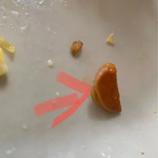 The small one I almost swallowed but bit down on