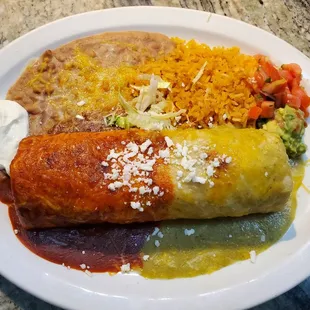 El Charro Burrito Plate ($16.99) - Flour Tortilla filled w/Chicken, Rice, Cheese, &amp; Beans. Topped w/ Red or Green sauce, served w/rice beans