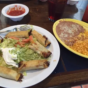 a plate of mexican food and a plate of rice