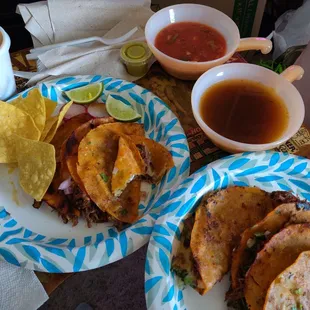 Quesabirria tacos with chips, salsa, and consomme