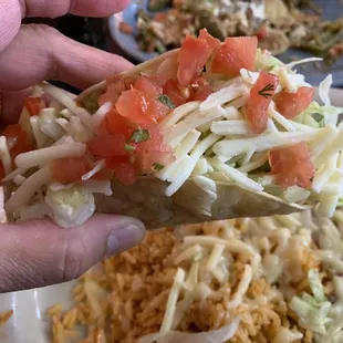 Combo with hard shell taco chicken and carne asada enchilada