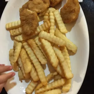 Kids menu, chicken nuggets and fries.