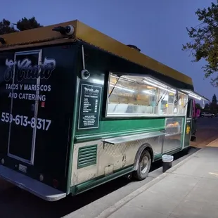 a food truck parked on the side of the road