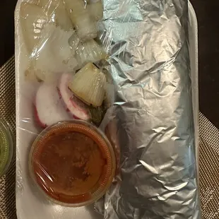 Burrito with grilled onions, radish and red salsa