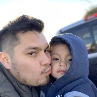 In line. in the back of the pickup getting some elotes chilindrinas and snow ones for the little ones.