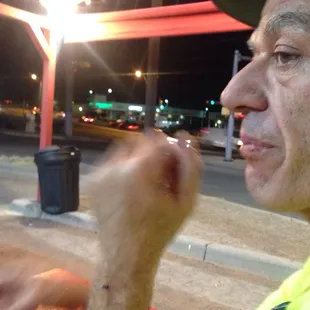 a man eating a hot dog