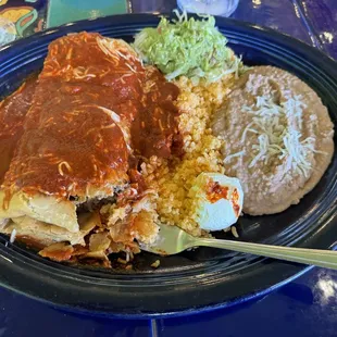 Chimichanga with enchilada red sauce filled with shredded beef and rice n refried beans and guacamole and sour cream. Awesome!!!