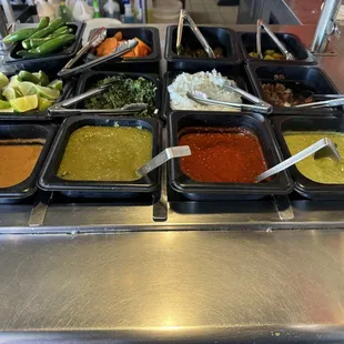 Salsa bar.  XXX hot habanero (didn't try.  I'm weak).  verde, red taqueria, avocado base (  )