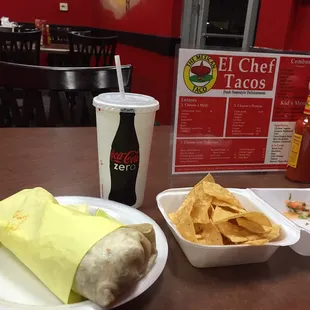 Chips Al Pastor burrito and a drink so good!