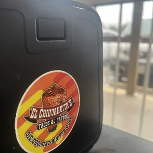 a sticker on a suitcase