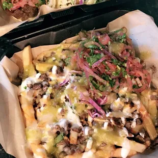 Tripas and shrimp taco and some carne asada fries! Could've used more cheese and sour cream on the fries but still good