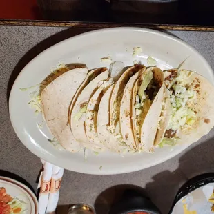 a plate of tacos and chips