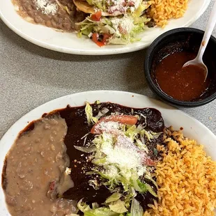 Tacos Dorados de Res (top) and enmoladas (enchiladas de mole) (bottom)