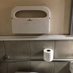 Empty toilet seat cover tin.