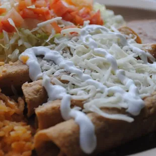 Flautas with rice and beans made to perfection and hits the spot just right. Ohh plus an orchata to finish it off