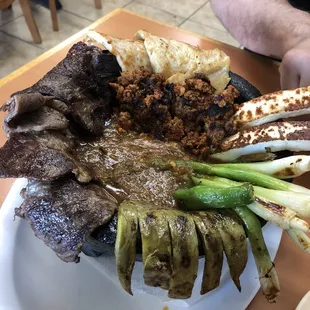 Very delicious Molcajete along with some handmade tortillas.
