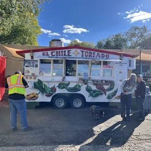 The truck is on the east side of the street, in shade.
