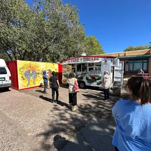 The food truck - set back from the street, pleasant shade available