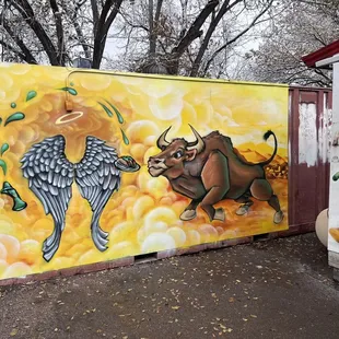 a bull and angel painting