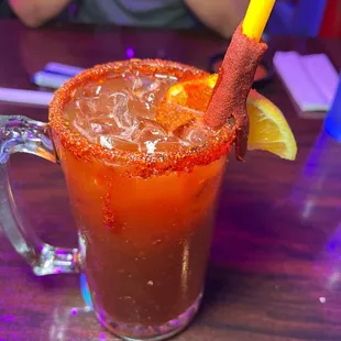 a bloody drink with a yellow straw