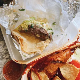 Birria taco / $3.85 + Enchilada (chicken) / $4