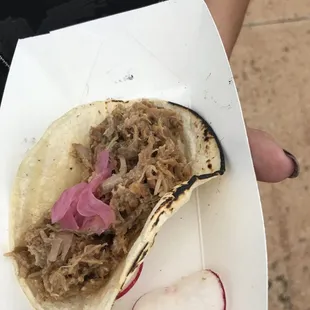 a person holding a plate of food