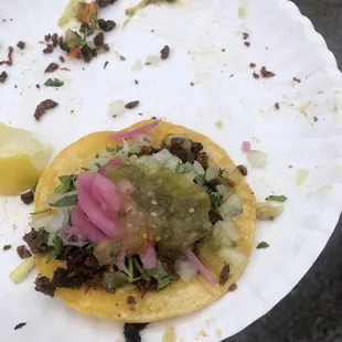 Not the best photo; asada w/ pickled onion, onion and cilantro, salsa, and a lemon.