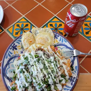 Chilaquiles con birria and 2 eggs over easy