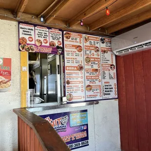 Menu is inside of the tented seating area/parking lot.