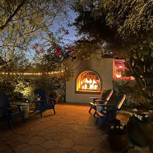 Cozy sitting area in front of the outdoor fireplace.