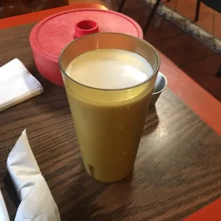 Horchata with tortillas in the background