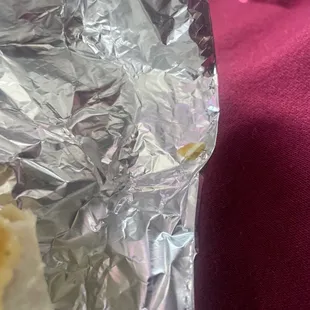 Piece of eggshell from egg and cheese burrito