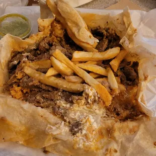 California Burrito inspection. Beans,rice, carne asada, sour cream, fries. Also comes with pico but I opted out.