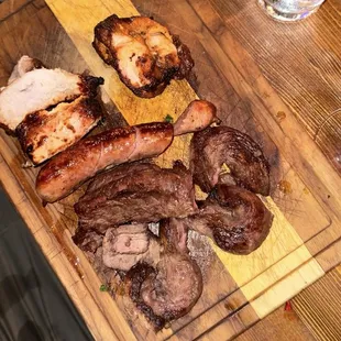 Half a pound of sausage, chicken, top sirloin and flat steak