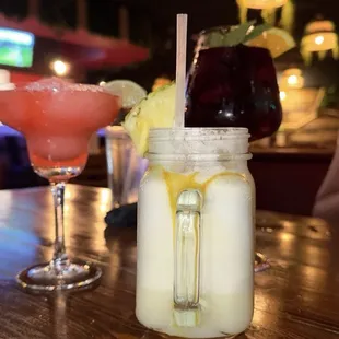 Strawberry margarita, piña colada, red sangria
