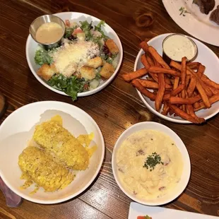 Sides. Kale salad. Corn on the cob. sweet potato fries. Mashed potatoes.