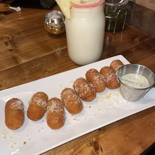 a plate of donuts and a drink
