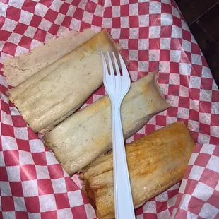 2 green chicken tamales and one red pork tamal