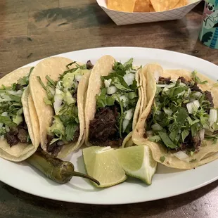 Tacos: Carne asada and cachete.