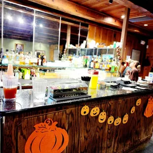 a bar with pumpkin decorations