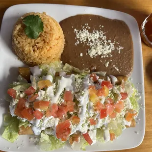 Under all that yumminess are three big flautas