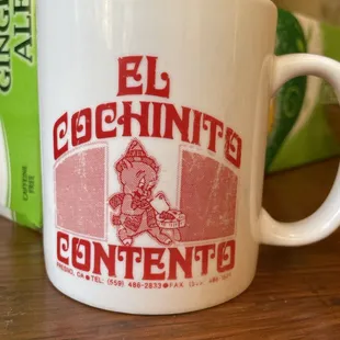 The cute little pig on the mug is as happy as we are when we eat there!