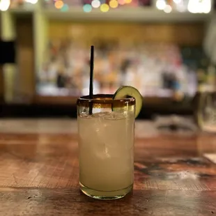 a margarita with a lime slice on the rim