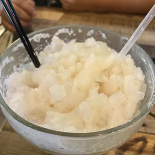 a bowl of rice with chopsticks